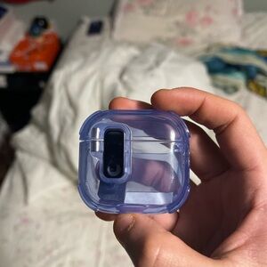 Blue AirPods 4 case comes with dust plug and sticker to stick to things.